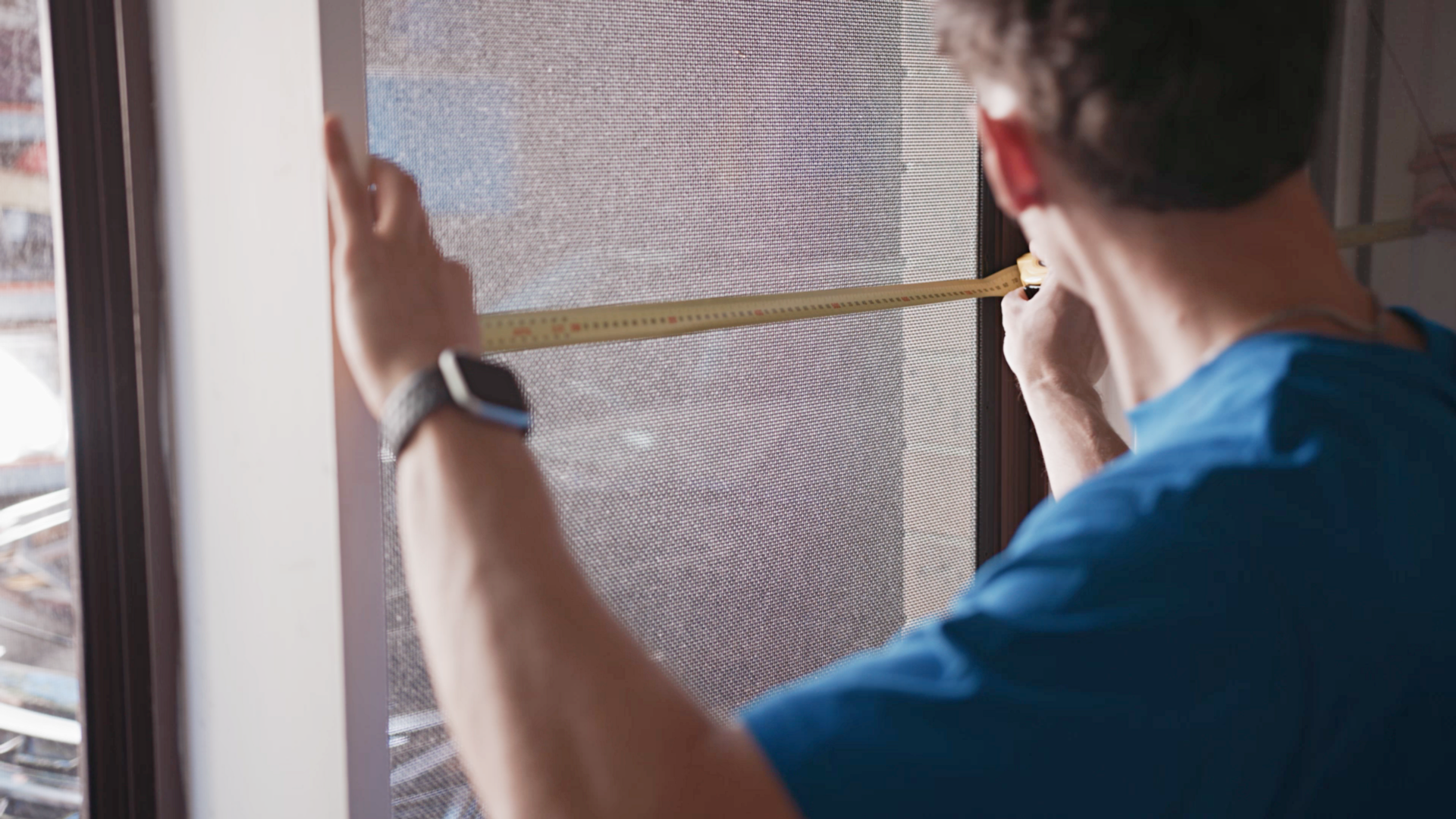 house removals cost - Close-up view of a professional taking precise measurements for a moving job