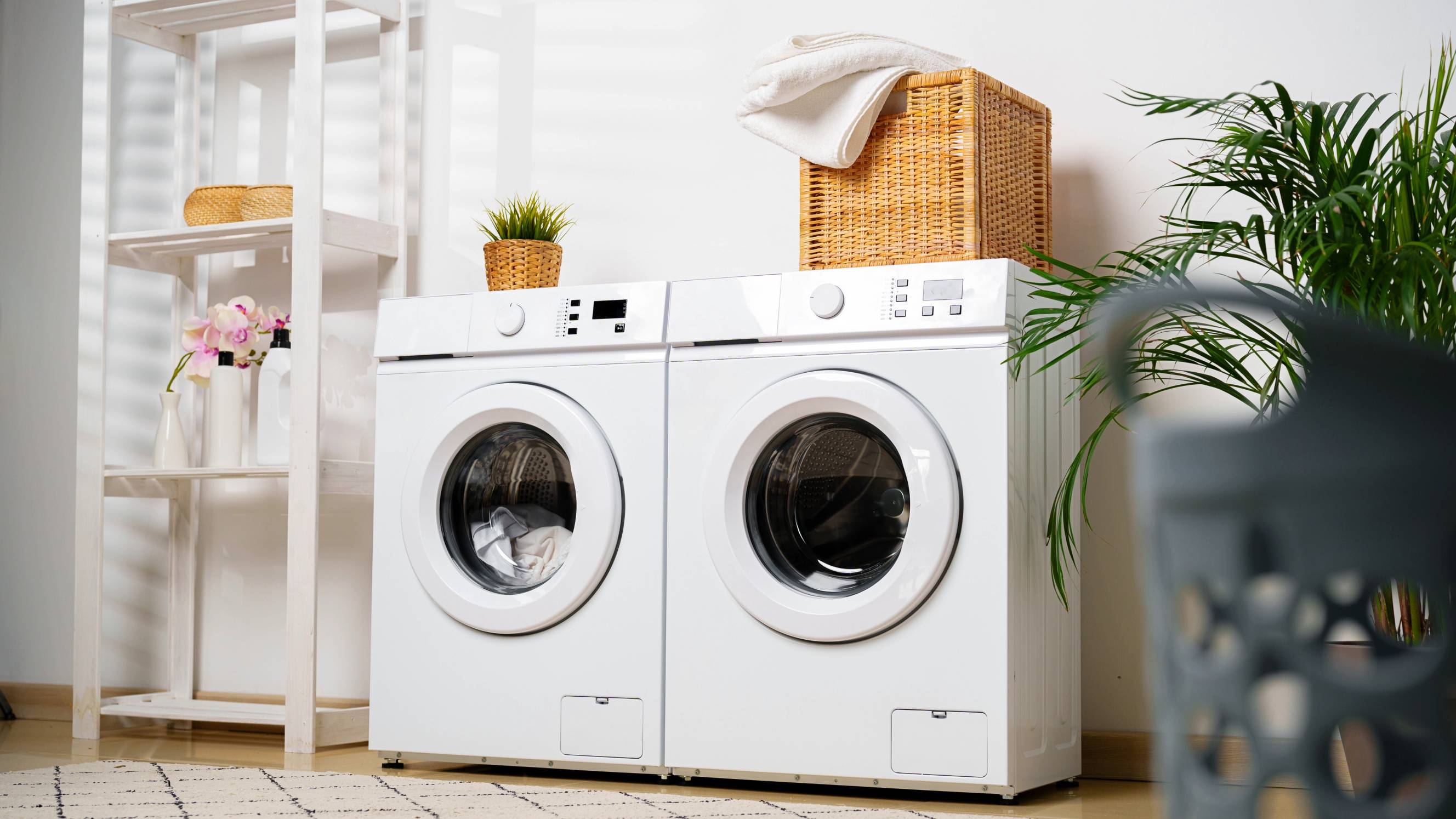 a pristine washer and dryer in a clean laundry room