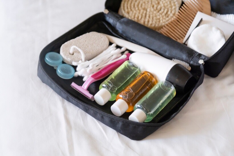 How to pack toiletries - Organized travel kit with razors, liquids, and grooming tools