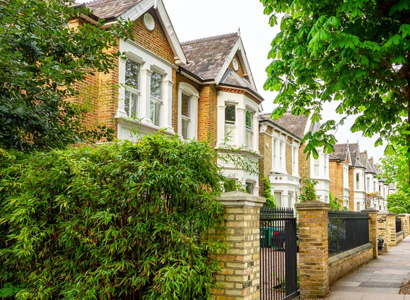 moving to London - Row of traditional Victorian-style terraced houses on a quiet London street