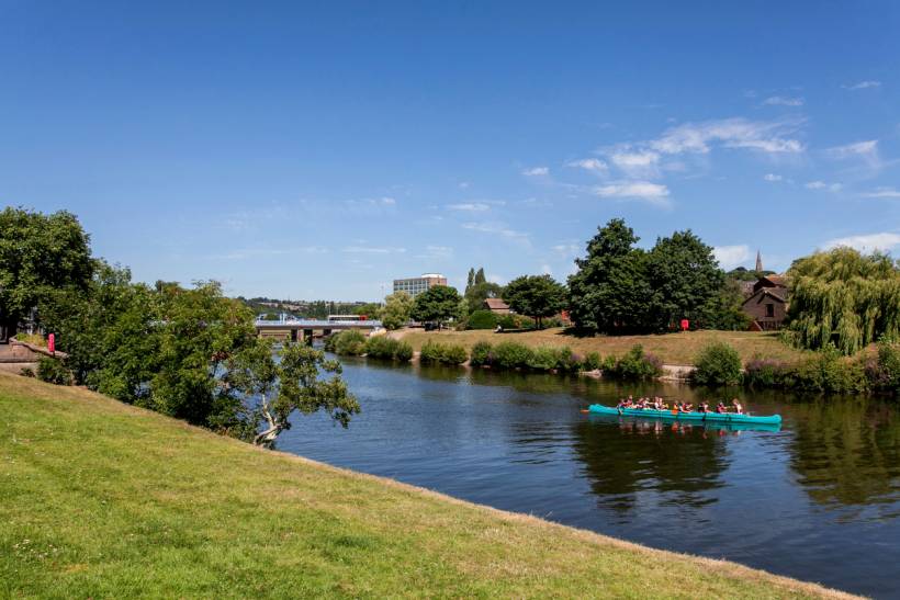 moving to Exeter - Group paddling along the calm waters of the River Exe