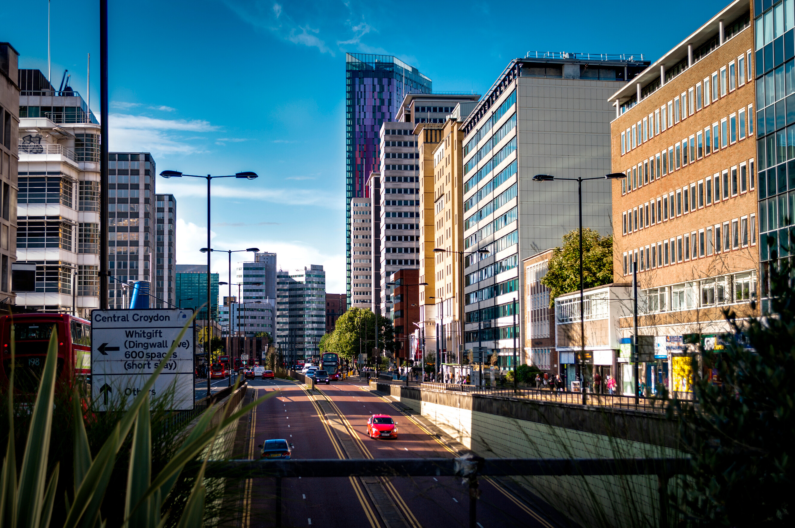 Vehicles navigating the modern road infrastructure and tunnels within the London Borough of Croydon.