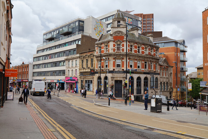 A wide view of the commercial shopping district and pavement in downtown Croydon. - moving to Croydon
