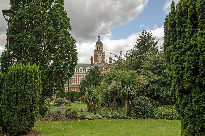 Queen’s Gardens with Croydon Town Hall visible behind trees and landscaped greenery. - moving to Croydon
