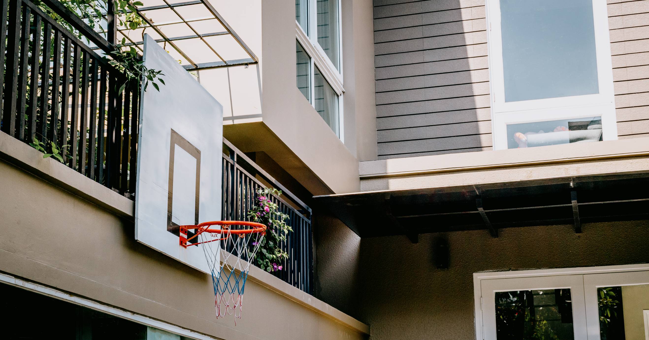 A basketball hoop assembled and installed outside of a home