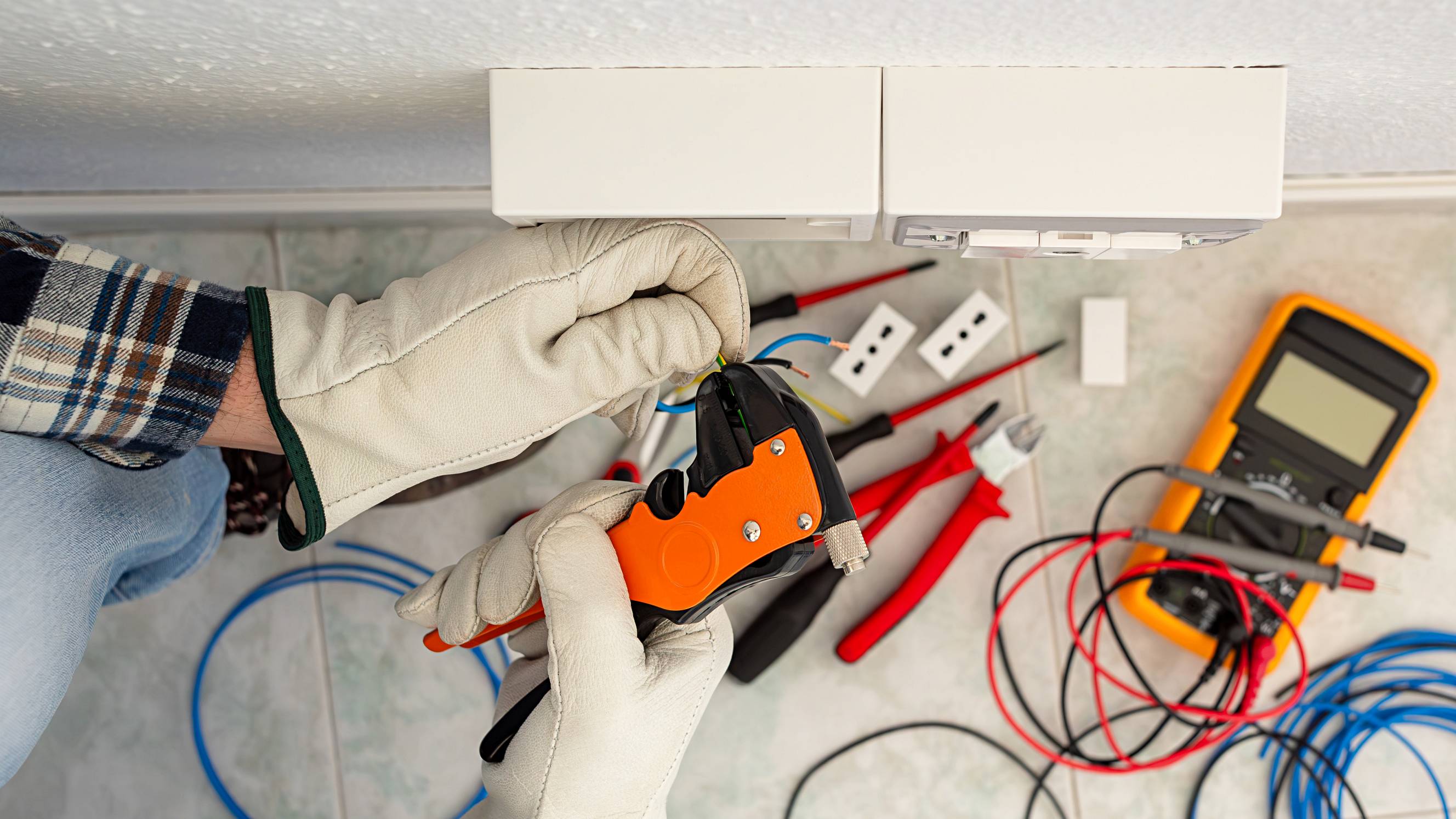 Electrician at work on a residential electrical system