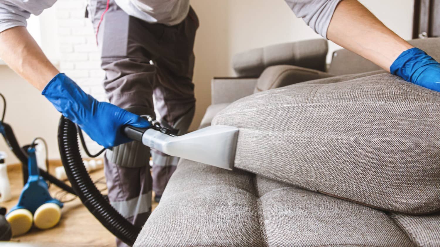 A professional cleaning service using a powerful machine to clean upholstery, removing dirt and stains, leaving it fresh and revitalized.