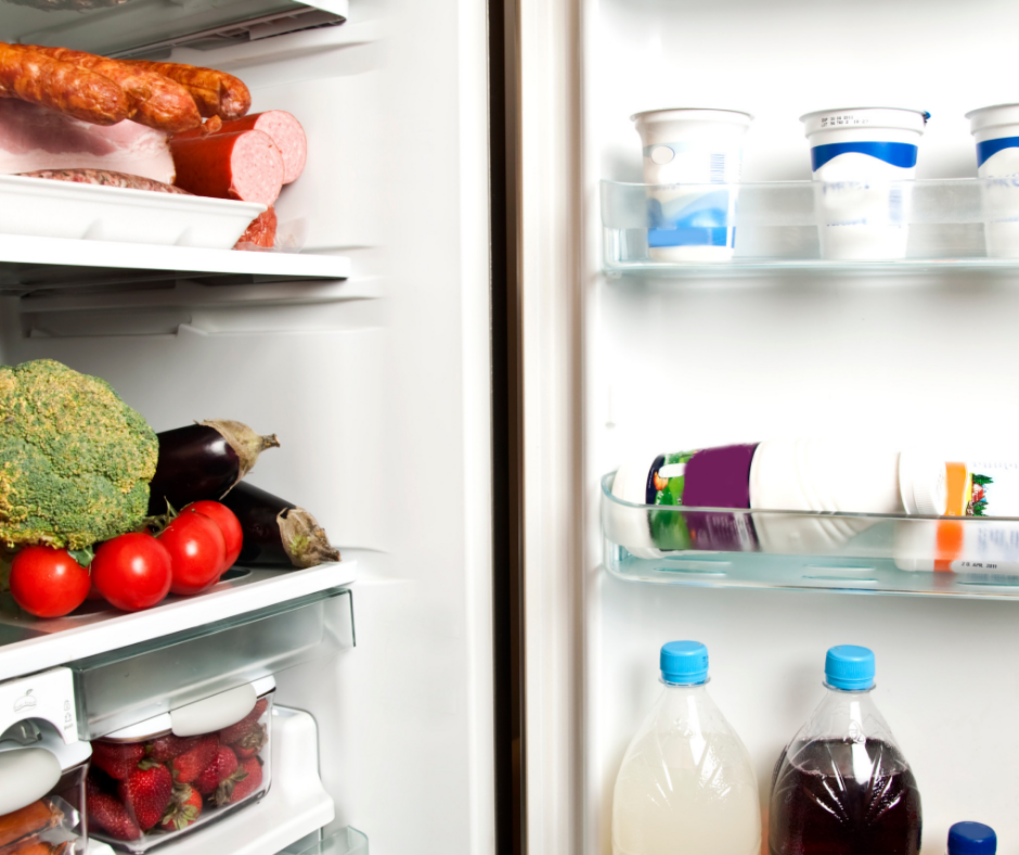 Open door refrigerator with food. 