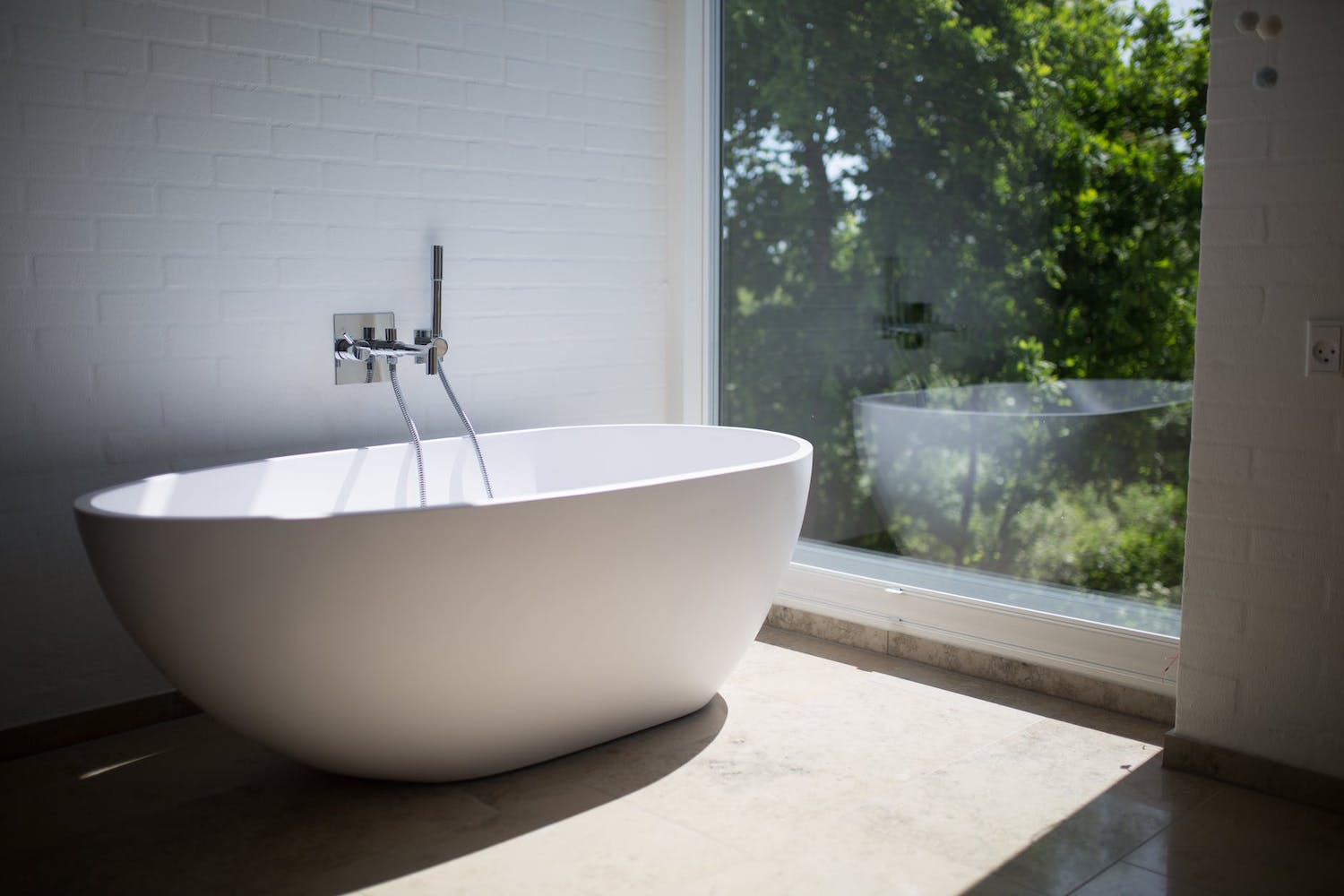 luxurious bath tub overlooking garden