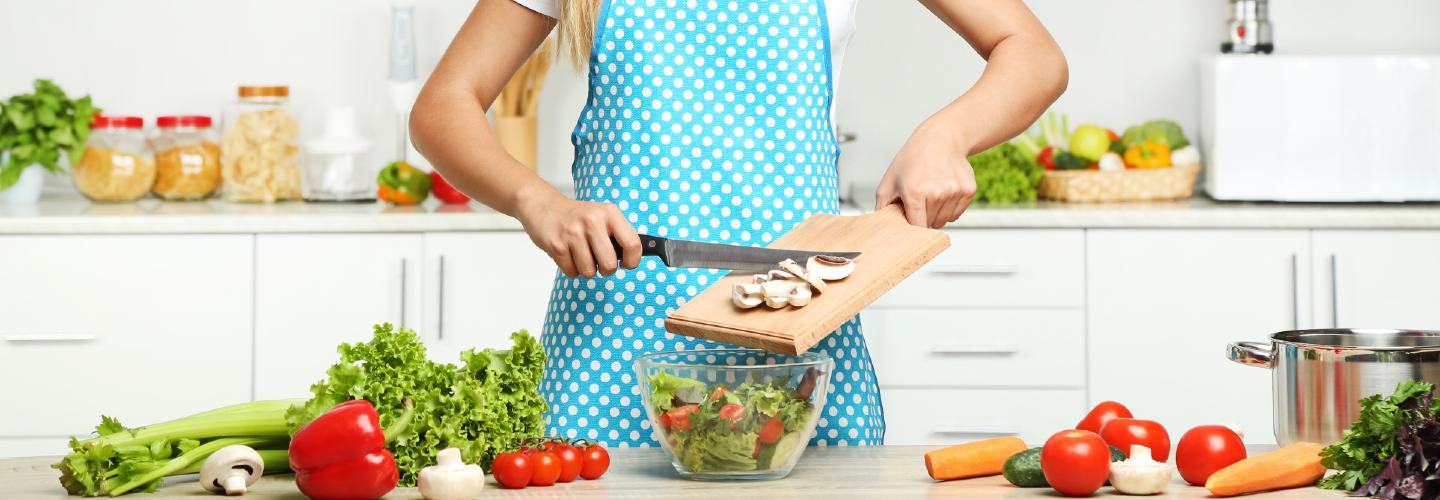 A colorful and nutritious vegan meal prep with a variety of vegetables, grains, and proteins arranged neatly in separate compartments.