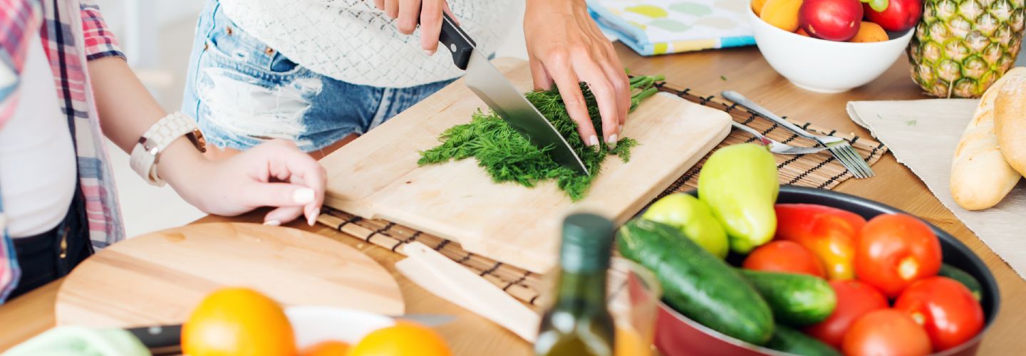 A colorful and nutritious vegetarian meal prep with a variety of vegetables, grains, and proteins arranged neatly in separate compartments.