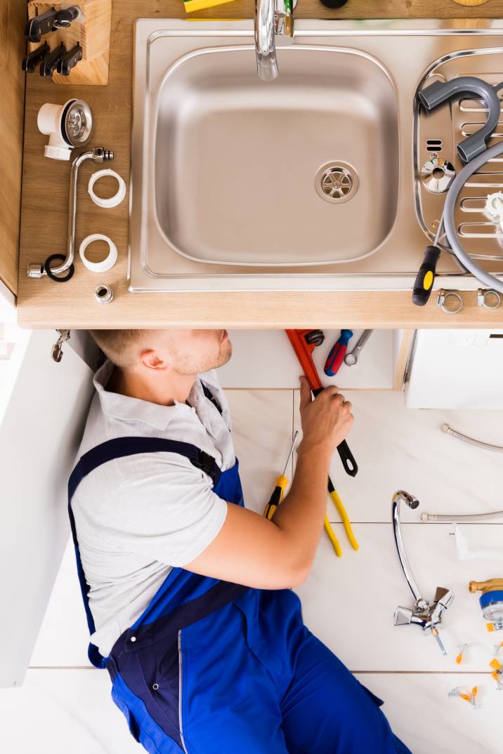 a male plumber completing a residential project