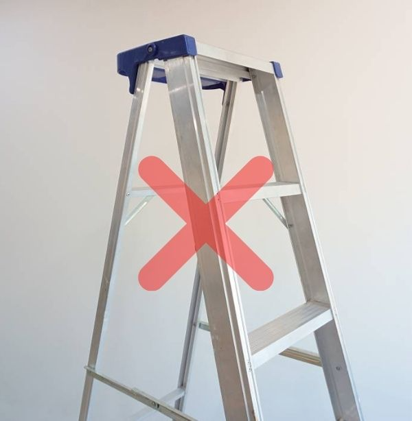image of stepladder with an "x" to warn people not to use it for cleaning gutters