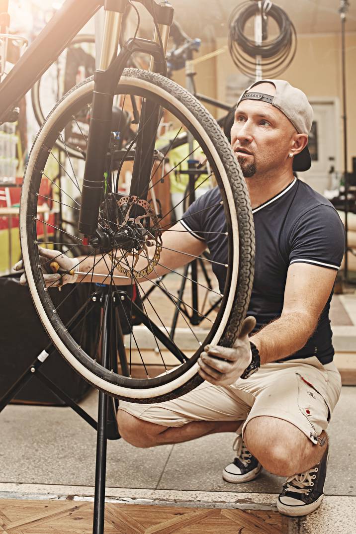 a man assembling a bicycle