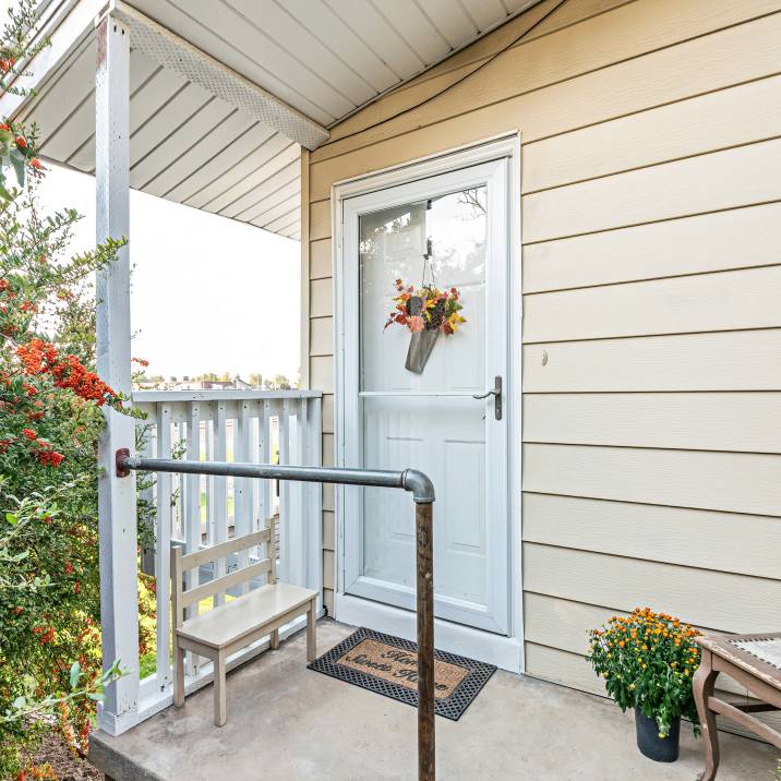 a cottage with a storm door