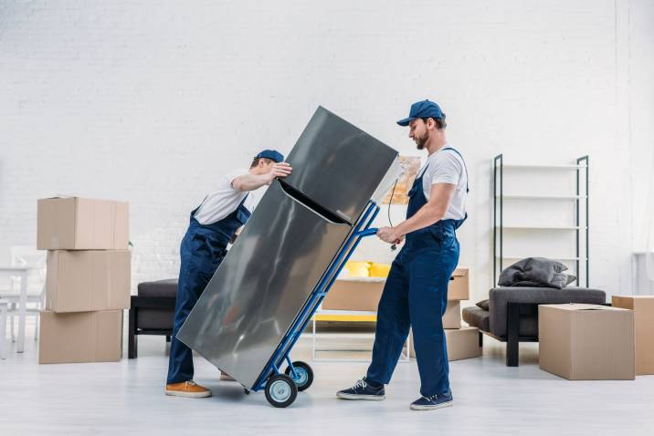 two men moving a fridge