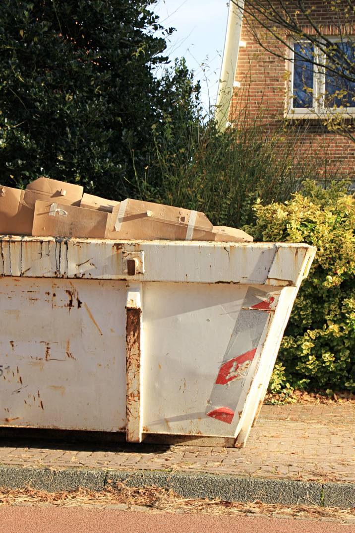 a dumpster full of boxes