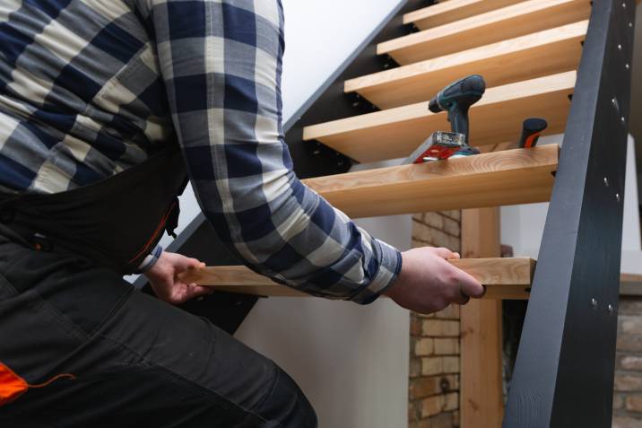 a handyman building a staircase