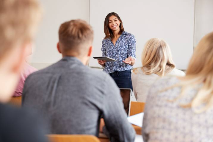 teacher lecturing in front of a class