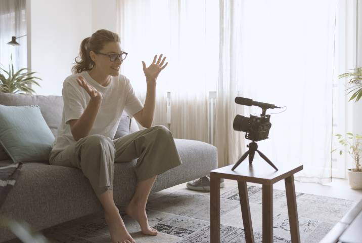 woman filming herself for a Youtube video