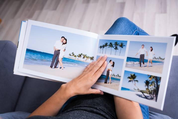 person browsing through a photo album