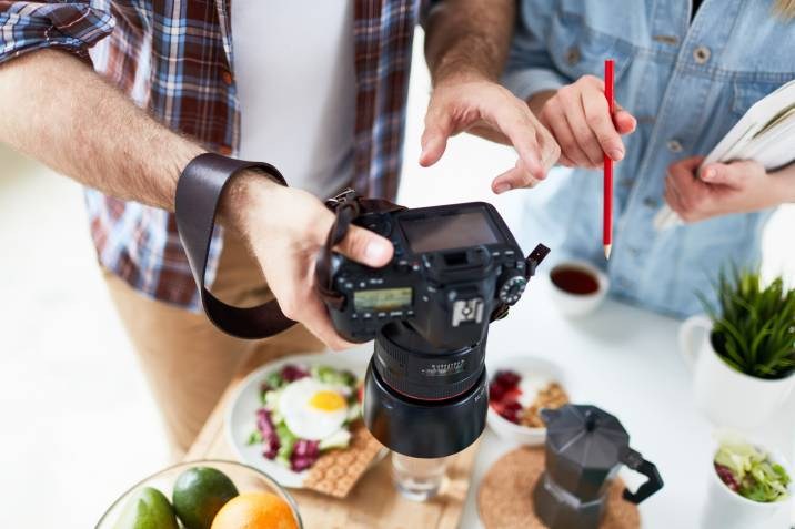 photographer discussing food photography angles with a client