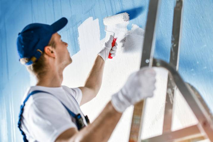 handyman painting a wall