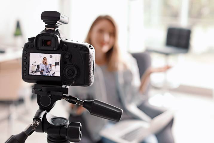 female teacher filming a course