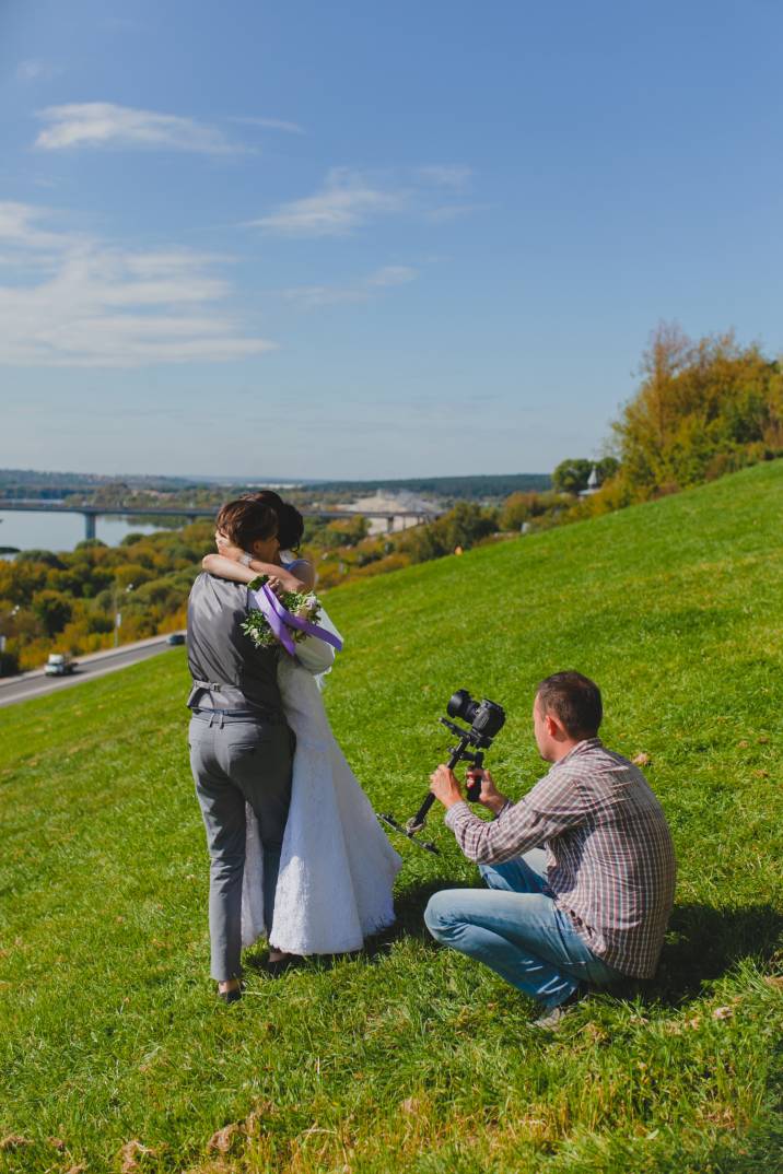 a wedding videographer recording a dancing couple