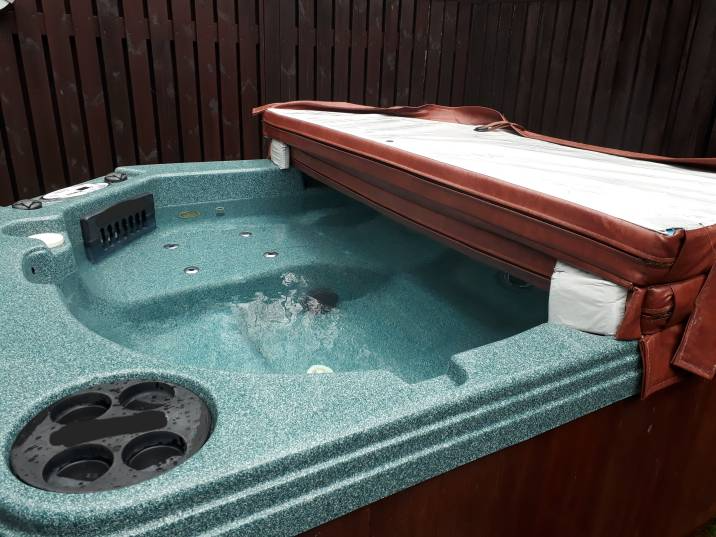 hot tub with an open foam core cover