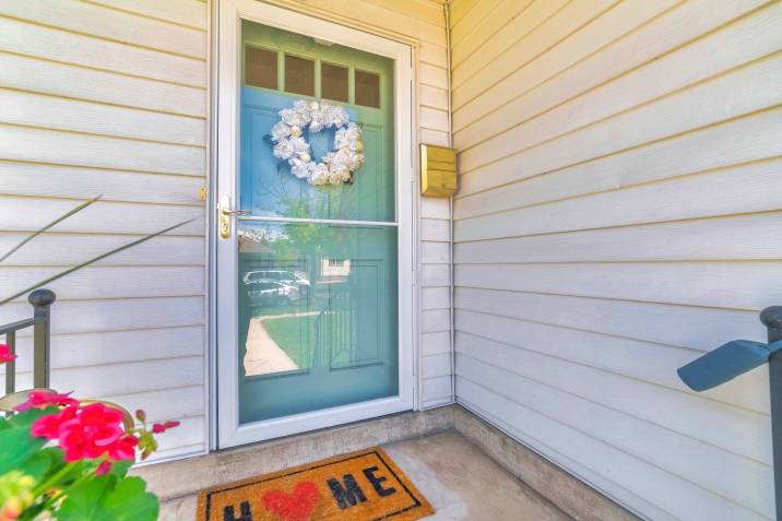 glass storm door installed on the front door