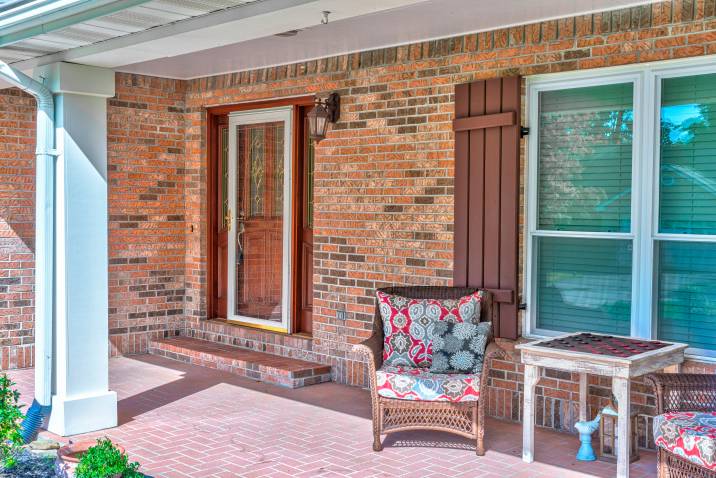 small glass storm door on the front door