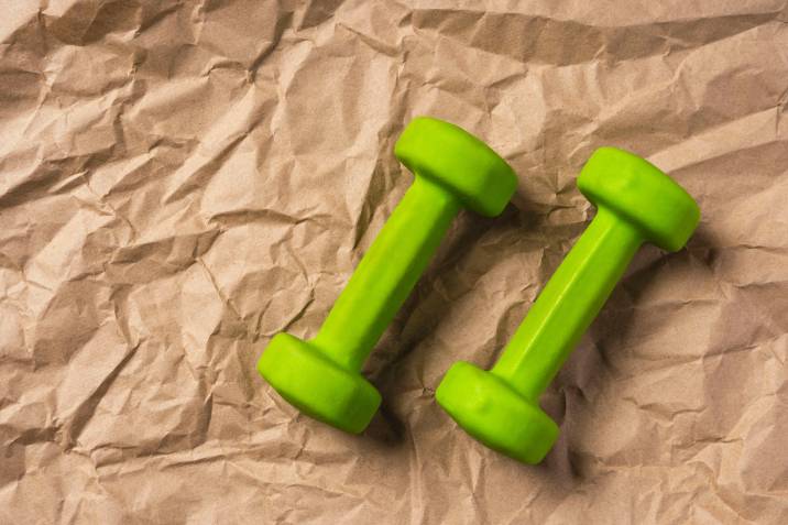 wrapping small dumbbells in paper for moving