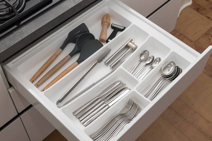 kitchen utensils in drawer for sorting and packing