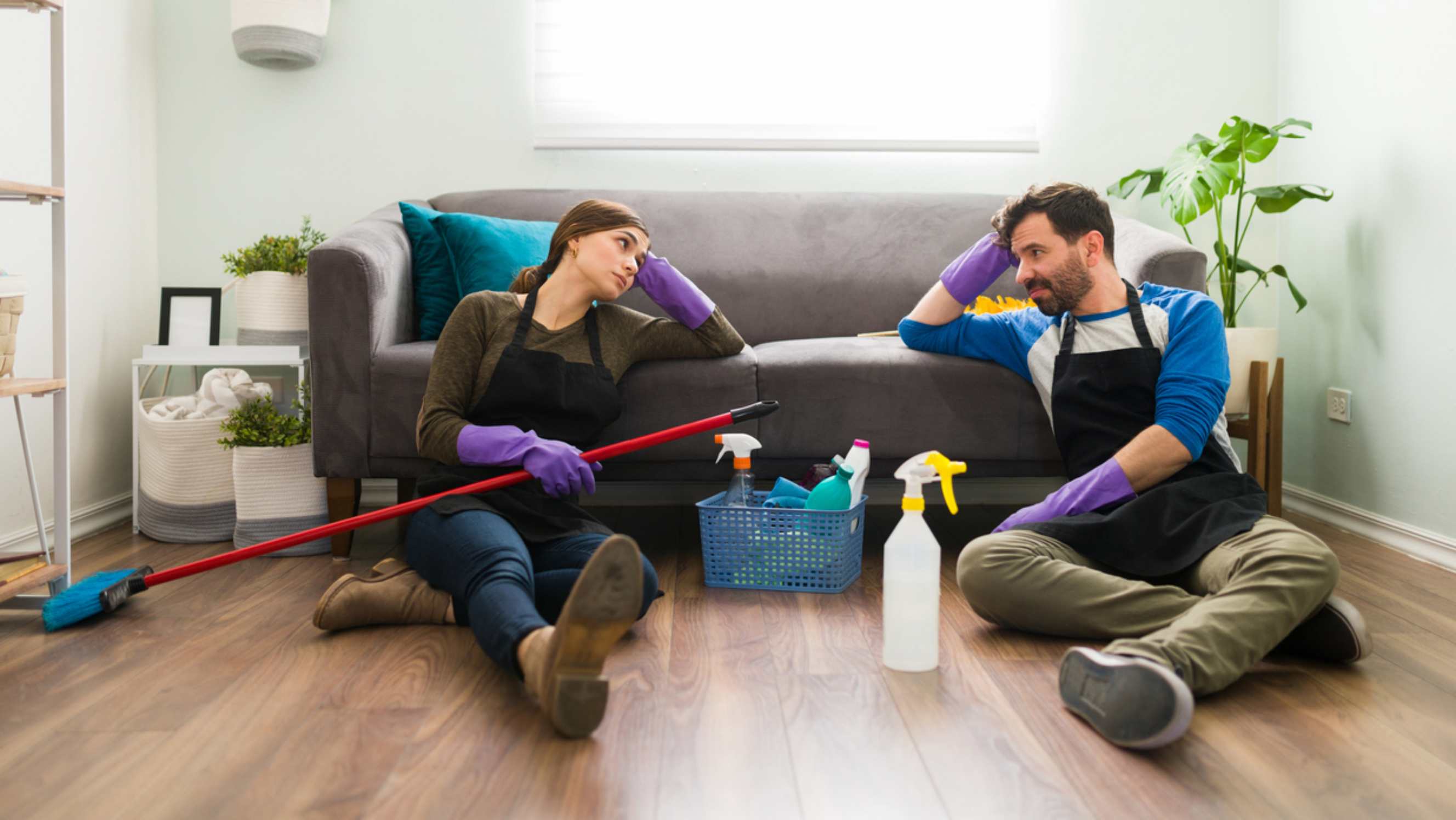 Housekeeper vs. cleaner - A housekeeper and a cleaner sitting on the floor