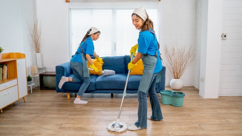 Housekeeper vs cleaner - Two cleaners cleaning a house with a wooden floor