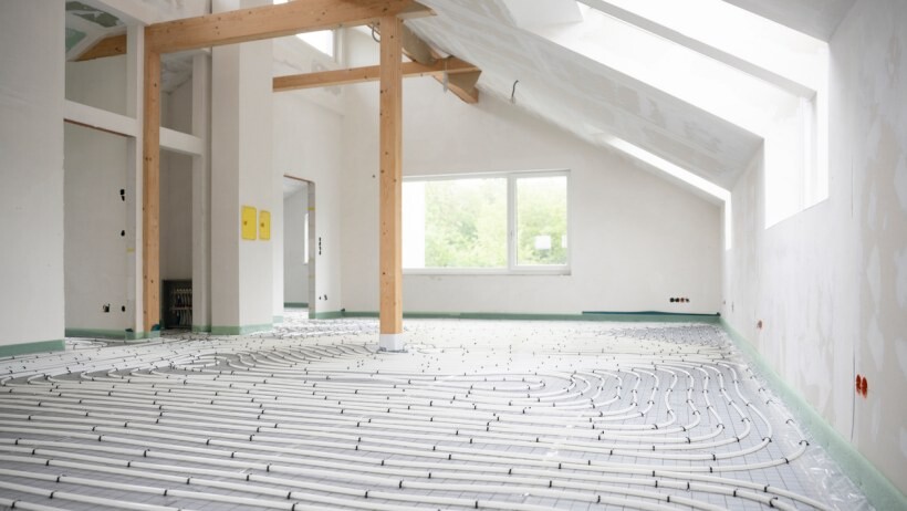 Underfloor heating vs radiators - Shot of construction site in a loft where floor heating has just been installed