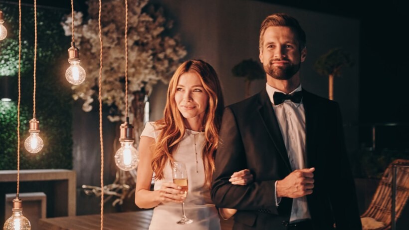 Tailored fit vs slim fit - A couple attending a party in a formal wear