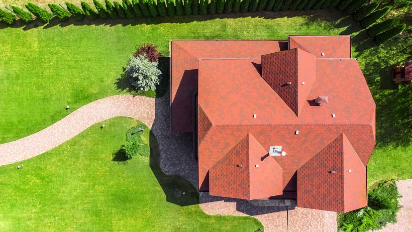 a top view of a massive home with new roof - new roof cost