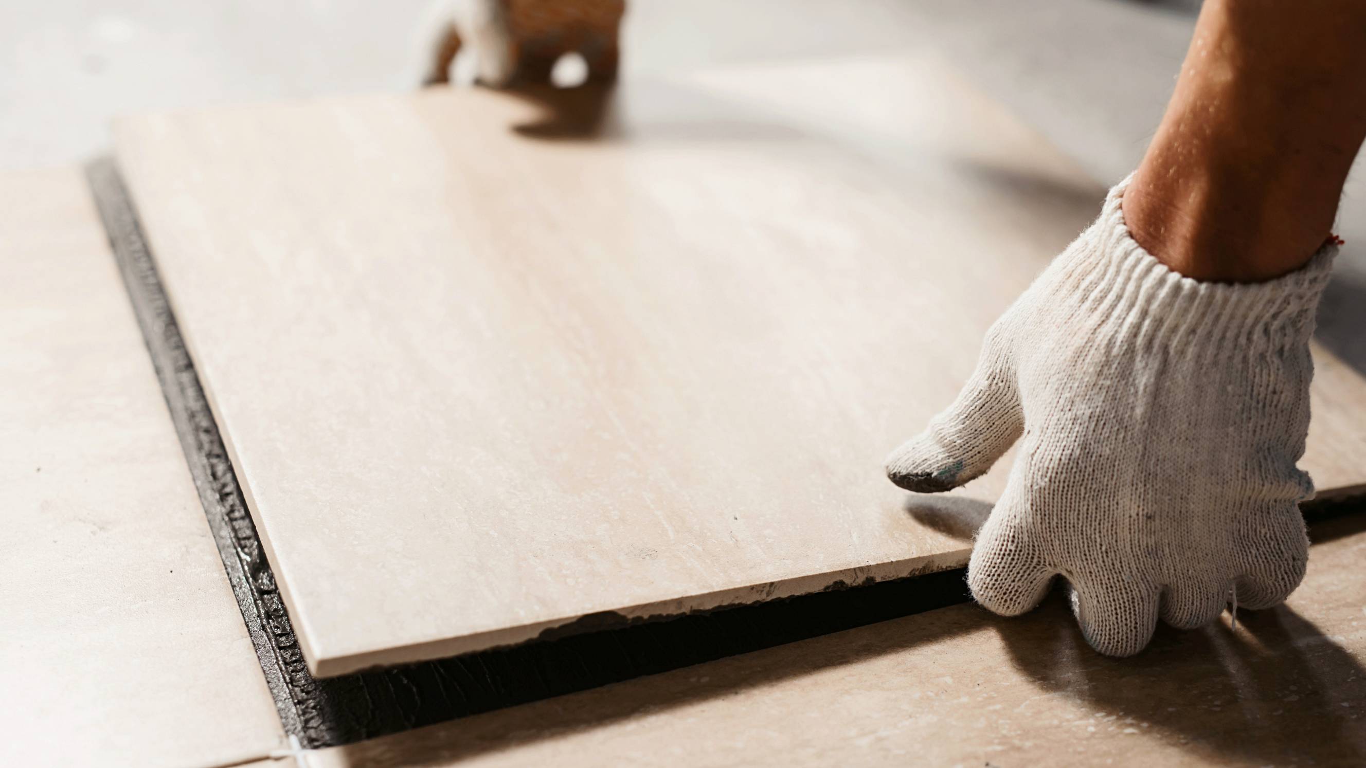 a tile flooring expert at work