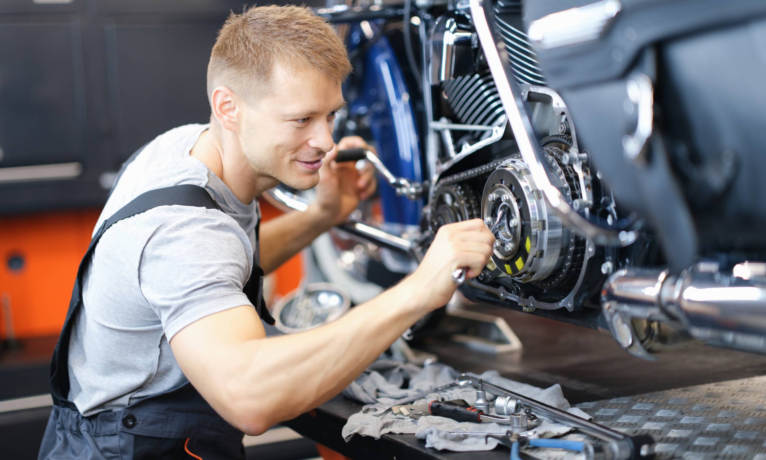 A mobile motorcycle mechanic near you is fixing a motorcycle