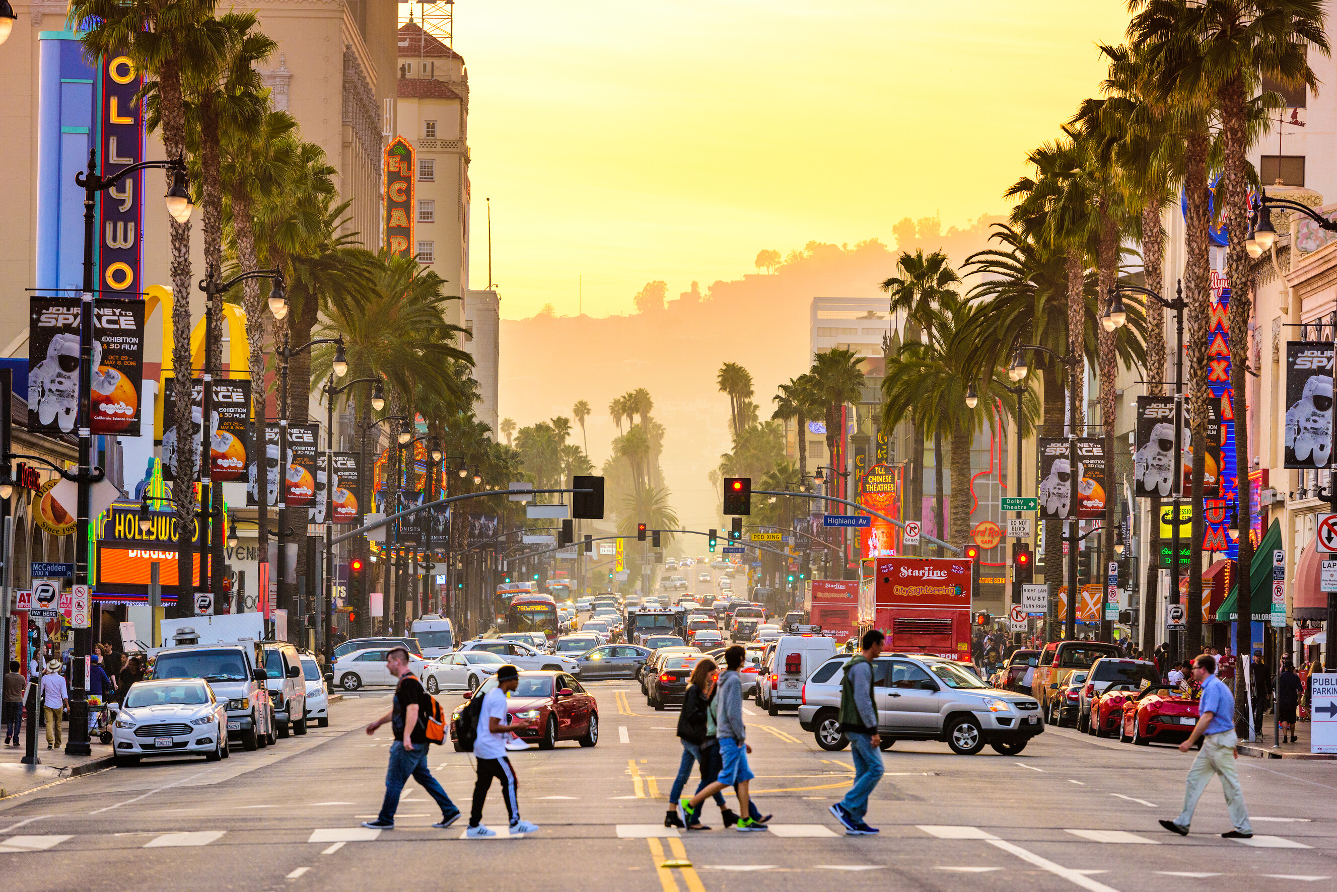 People walking along the famous Hollywood Boulevard pavement during the day.