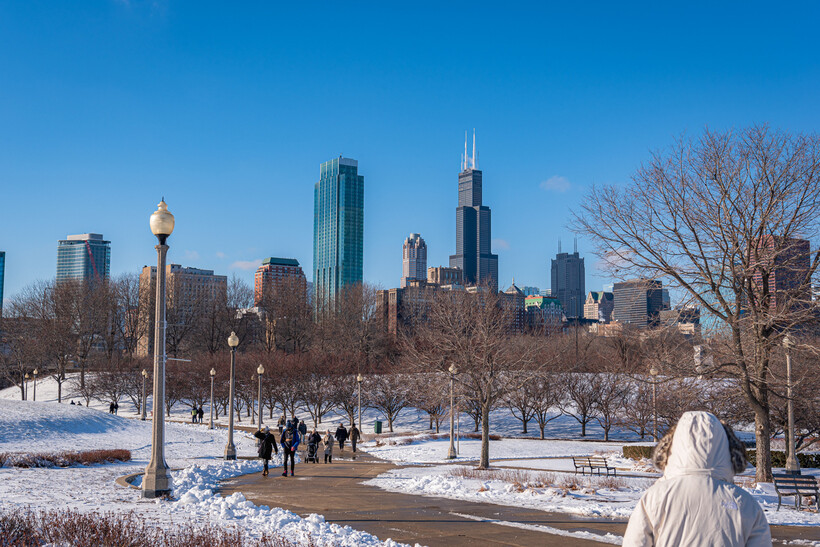A crisp winter day view of the Chicago city skyline with snow on the ground. - moving to Chicago