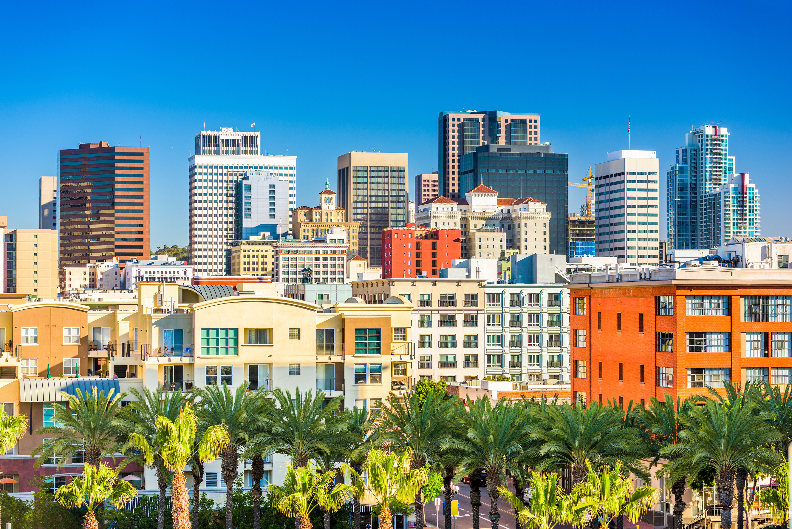 Modern high-rise buildings of downtown San Diego along the sunny coastal waterfront.