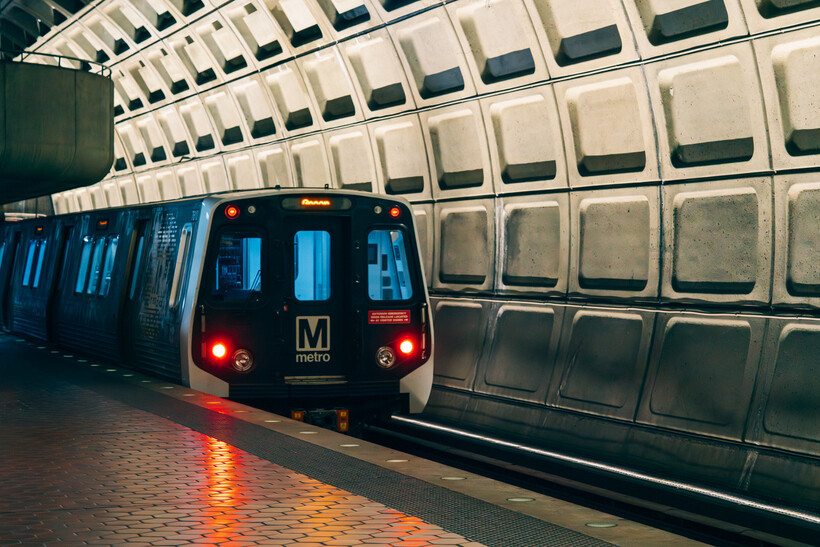 A Metro train entering an underground station with its signature vaulted brutalist ceilings. - moving to Washington DC