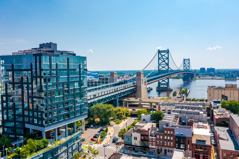 An aerial view of the city skyline looking toward the Ben Franklin Bridge. - moving to Philadelphia