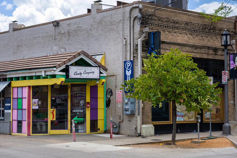 Historic brick storefronts and colorful signage in the Deep Ellum district. - moving to Dallas