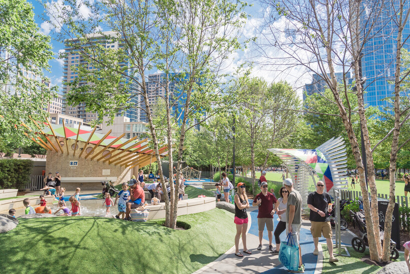 Children playing in a modern outdoor playground area at Klyde Warren Park. - moving to Dallas