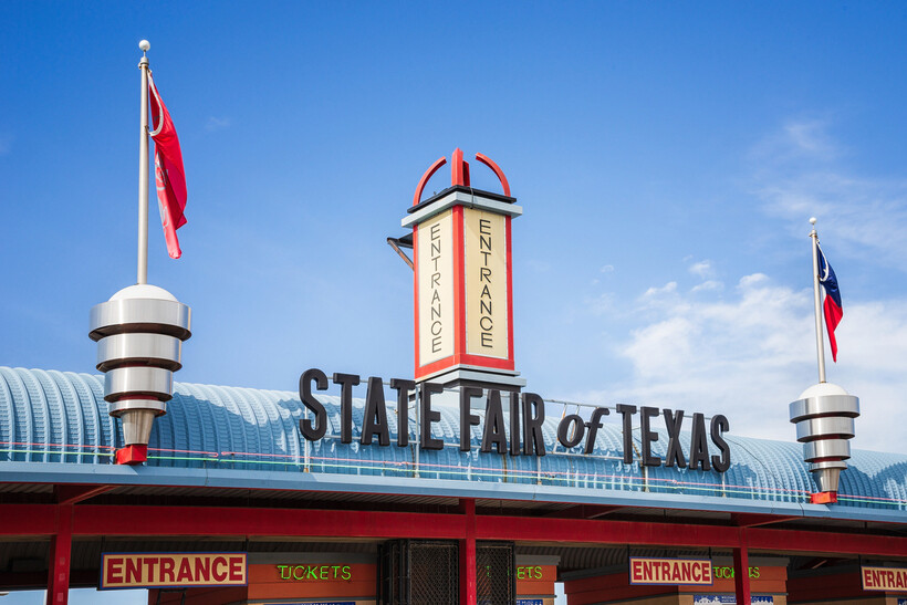 The ornate gated entrance to the Fair Park grounds for the State Fair of Texas. - moving to Dallas