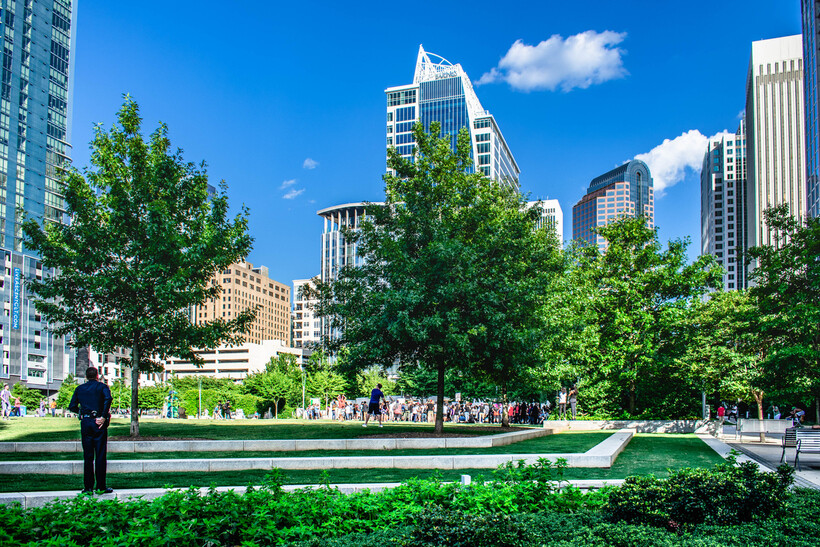 Residents and visitors enjoying the open green space at Romare Bearden Park. - moving to Charlotte NC